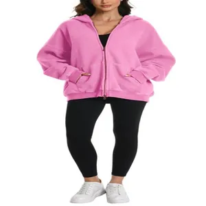 Stijlvolle roze oversized hoodie met capuchon, dubbele rits en kangoeroezakken.