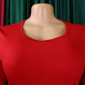Macro close-up view of the round neckline on a vibrant red office commute lady dress