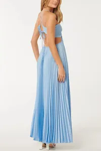 Detailed side view of a light blue pleated maxi dress with back cut-out and tie