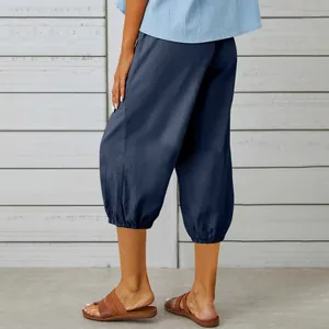 Detailed back view of casual navy blue cropped cotton linen pants with gathered hem
