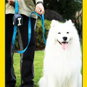 Blue dog waste bag dispenser pouch attached to a leash with bone pattern