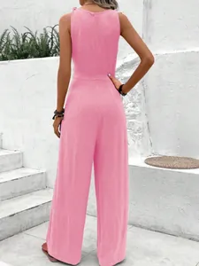 Detailed back view of a pink sleeveless wide-leg jumpsuit featuring minimalist design