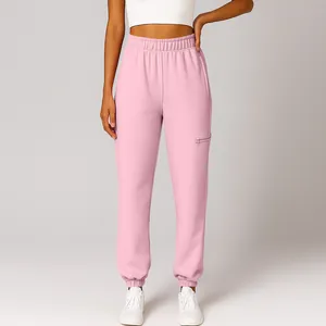 Close-up of comfortable pink high-waisted joggers featuring a side zipper pocket detail