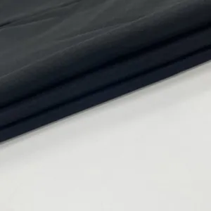 High-quality close-up of soft black breathable fabric texture for a summer dress