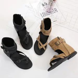 Multi-angle detail of lightweight Roman sandals with ankle straps in black and tan.
