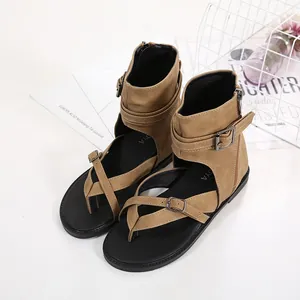 Close-up of khaki high-top Roman sandals featuring buckle straps and soft soles