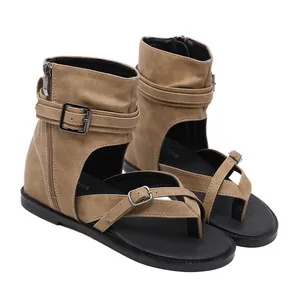 Detailed side view of khaki Roman gladiator sandals with buckles and side zippers