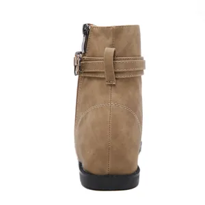 Detailed rear view of a khaki tan women's ankle boot with decorative buckle strap
