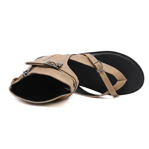 Detail view of khaki Roman gladiator sandals with buckles and zipper closure.