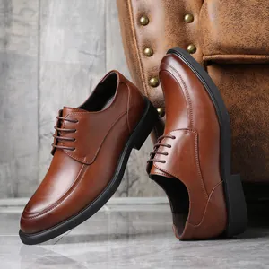 Detail view of premium brown leather business dress shoes with elegant lace-up design