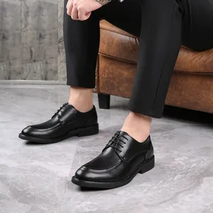 Classic black leather derby shoes for men shown in a professional lifestyle setting
