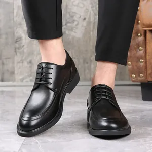 Close-up of stylish black lace-up men's formal leather shoes worn for a business look