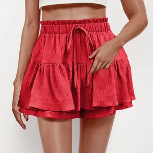 Detail view of red ruffled tiered mini skort featuring elastic drawstring waist design