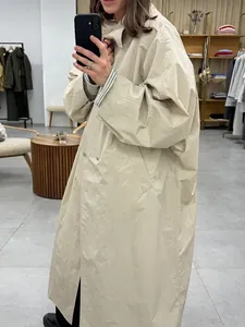 Chic oversized light apricot trench coat with large lapel and double-breasted design