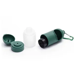 Macro view showing the dark green pet waste bag dispenser and hand sanitizer bottle