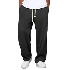 Vue détaillée d'un pantalon décontracté large pour homme en maille gaufrée gris foncé