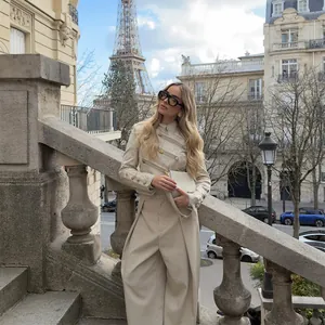 Elegant beige Chinese style jacquard jacket with matching wide-leg trousers in Paris.