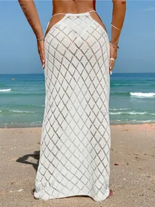 Detailed back view of a sexy white crochet knit beach maxi skirt with diamond pattern.
