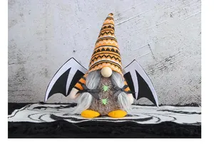 Detailed view of Halloween gnome plush doll featuring bat wings and striped knitted hat