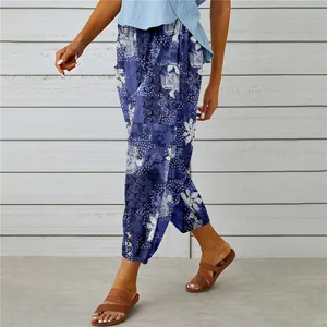 Detail view of vintage printed cotton-linen cropped pants with ankle button accents.