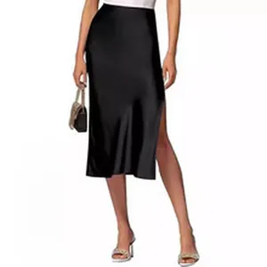 Close-up detail of an elegant black satin midi skirt featuring a stylish side slit design