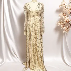 Full-length view of champagne mesh evening gown with intricate golden sequin patterns