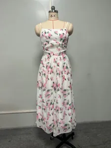 Detail of a floral print chiffon maxi dress with spaghetti straps on a mannequin