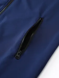 Close-up detail of a secure zippered pocket on a navy blue athletic sports jacket