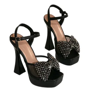 Elegant black high heel platform sandals with sparkly rhinestone bow for party events