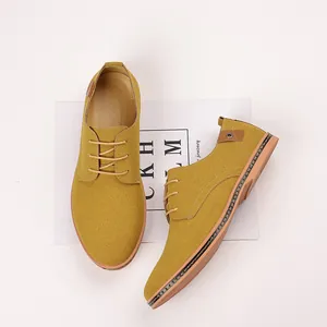 Detailed top view of mustard yellow suede men's casual lace-up derby shoes for spring.