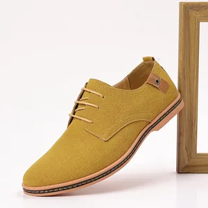 Close-up side view of men's mustard yellow suede casual shoes with lace-up details