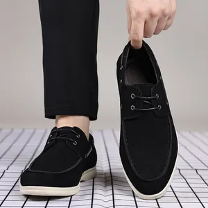 Close-up of men's black suede casual loafers with minimalist British style design
