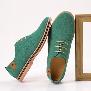 Macro view of green suede men's casual derby shoes featuring a stylish lace-up design