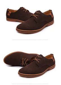 Close-up of men's brown suede lace-up casual shoes with decorative side straps.