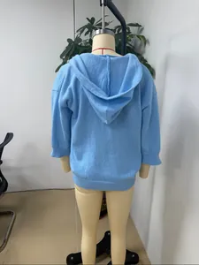 Back view detail of light blue knitted hooded cardigan sweater shown on mannequin
