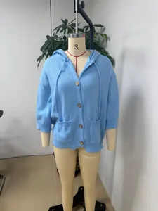 Light blue hooded knit cardigan with buttons and pockets shown on a studio mannequin