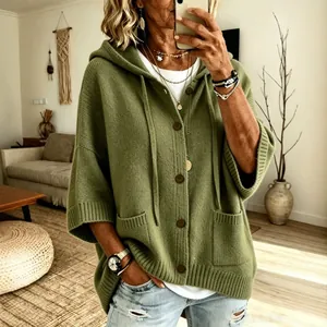 Stylish lifestyle view of a sage green buttoned hooded knit cardigan for women
