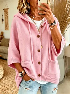 Detailed view of a soft pink hooded knit cardigan with button-front and pockets