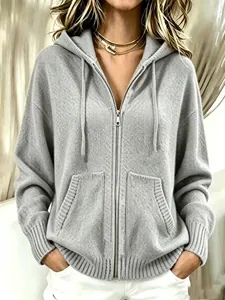 Detailed view of a soft grey women's hooded zip-up knit cardigan with a loose fit.
