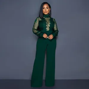 Mono elegante de lentejuelas verde oscuro con cuello alto de encaje y manga larga