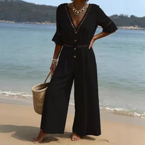 Elegant black V-neck jumpsuit with short sleeves and lace trim for vacation fashion