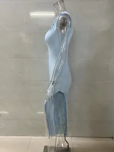 Side view of elegant light blue ribbed knit sleeveless maxi dress with high side slit