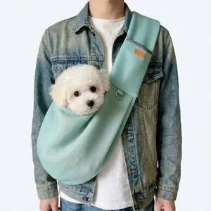 Light blue breathable mesh pet sling bag for small dogs and cats, portable carrier strap.