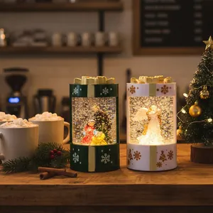 Decorative glowing Christmas snow globe gift box lanterns with Nativity and Angel