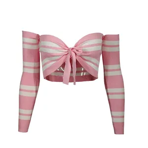 Close-up of pink and white striped knit long sleeve crop top featuring front bow tie detail