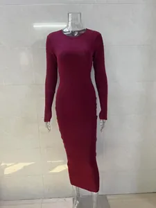 Detailed front view of a burgundy long-sleeved ribbed knit dress on a clear mannequin.