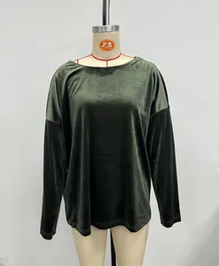 Dark green velvet long sleeve top with round neck shown on a mannequin form