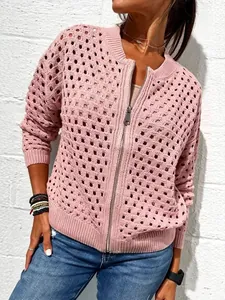 Detailed view of women's pink hollow-out knit jacket with stylish zipper closure design