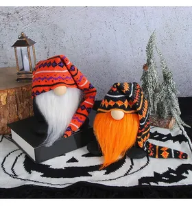 Detailed view of Halloween gnomes with long knitted hats and plush beards on a table