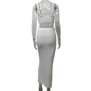 Back view detail of a white knitted two-piece set featuring a camisole and maxi skirt